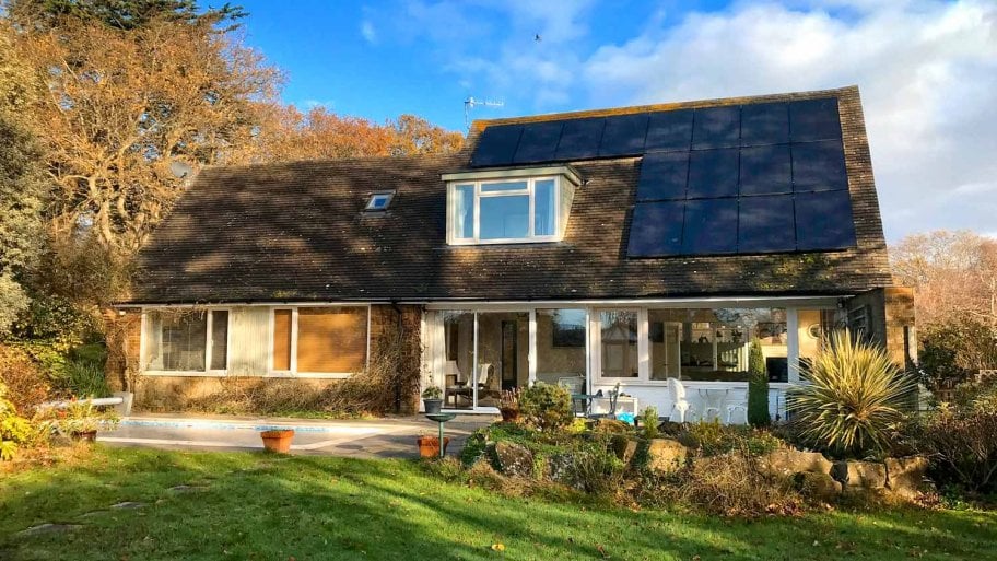The exterior of a house with solar panels on its roof