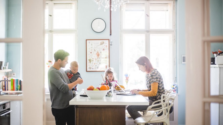 A family spending quality time in their bright kitchen