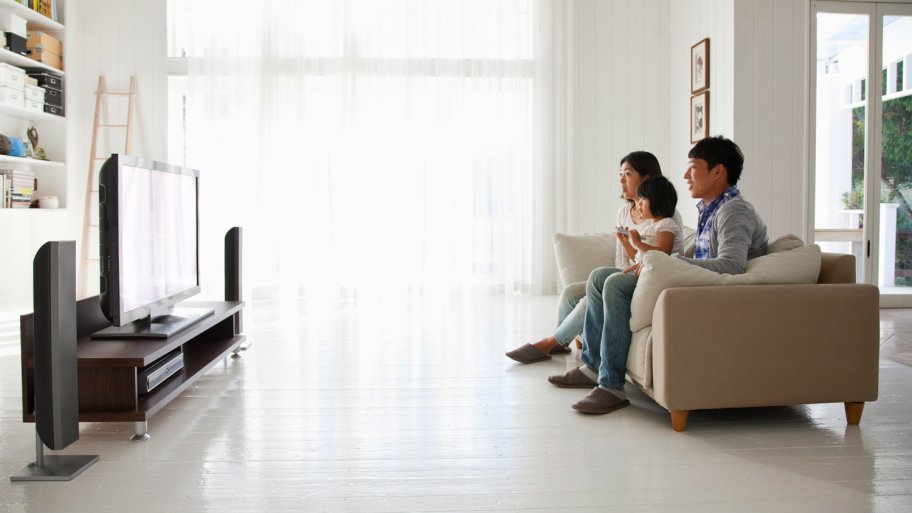 A family watching TV in living room