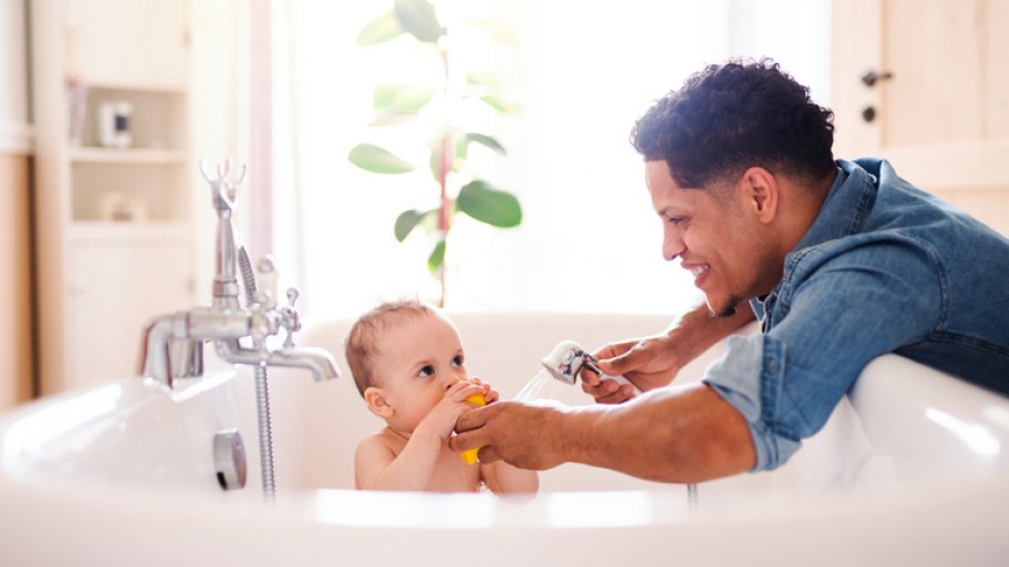 Father giving son a bath