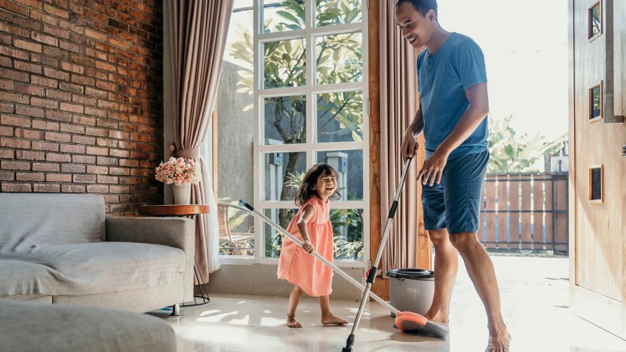 Little girl cleaning house with her dad (Photo by ferlistockphoto / iStock /Getty Images Plus via Getty Images)