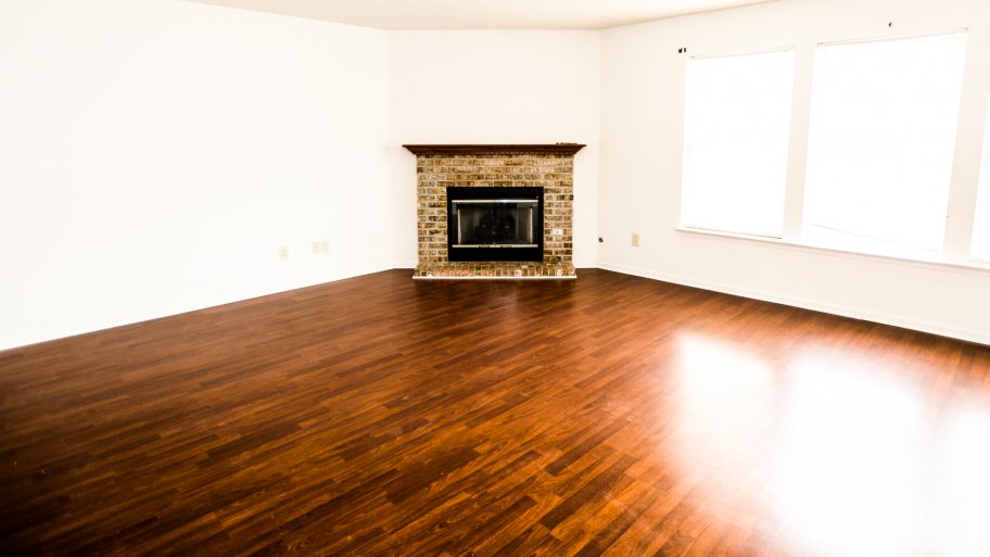 hardwood flooring and a fireplace