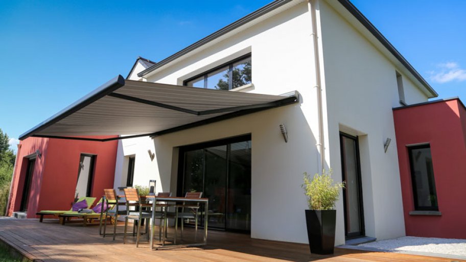 modern home backyard patio with awning