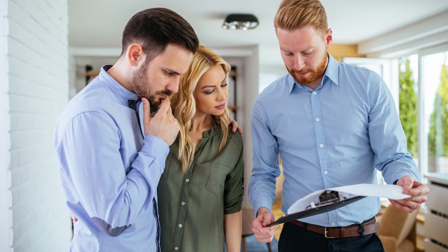 Homeowners looking over bid