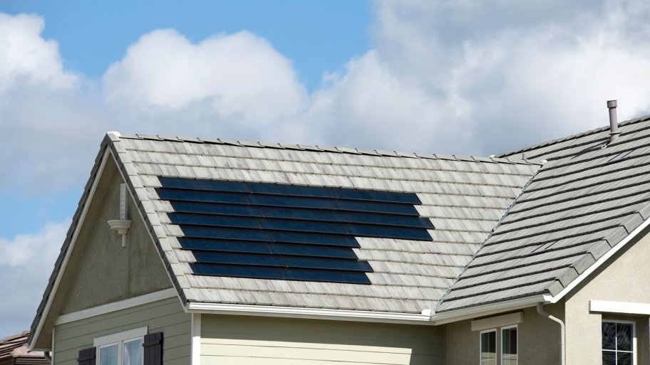 A house with solar shingles on its roof