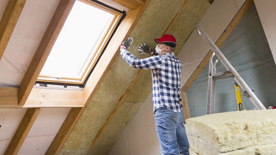 Man installing thermal insulation
