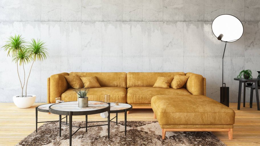 A living room with a yellow sofa
