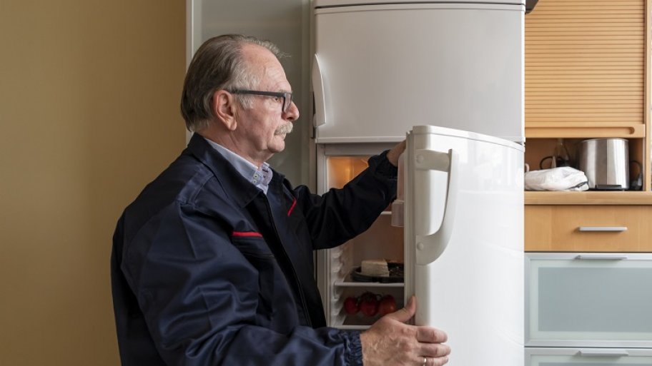 Man fixing refrigerator