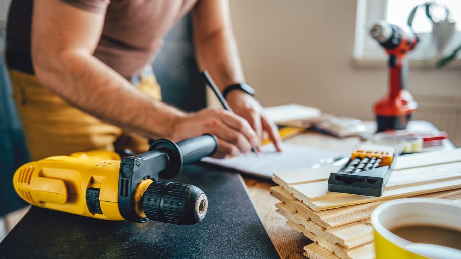 contractor working on table with power tools