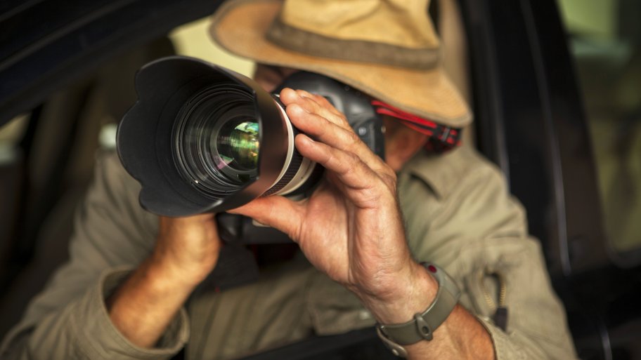 Private investigator with camera