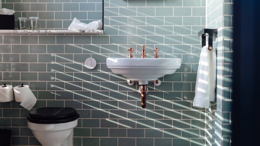 Sunlight coming through from the window in a stylish bathroom