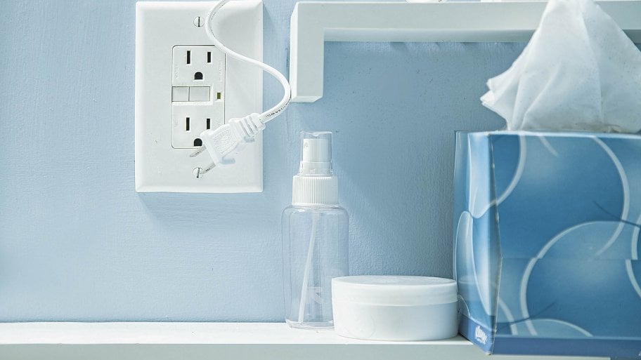 outlet on blue wall