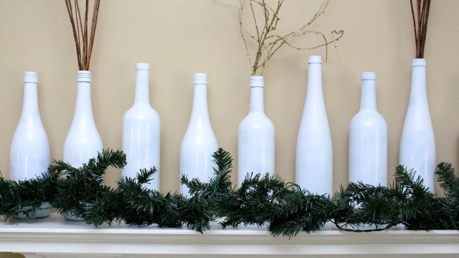 garland and wine bottle decorations on mantel