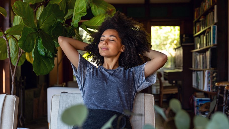 Woman breath deeply in her home