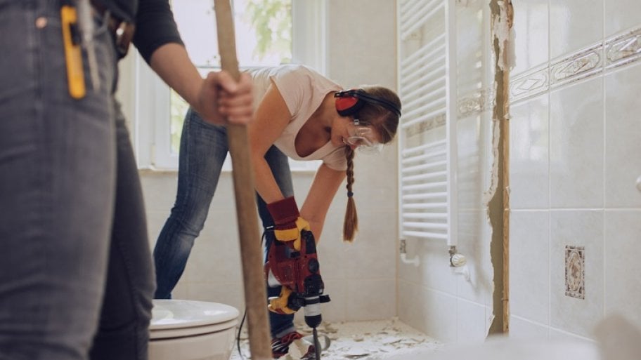Woman remodeling bathroom