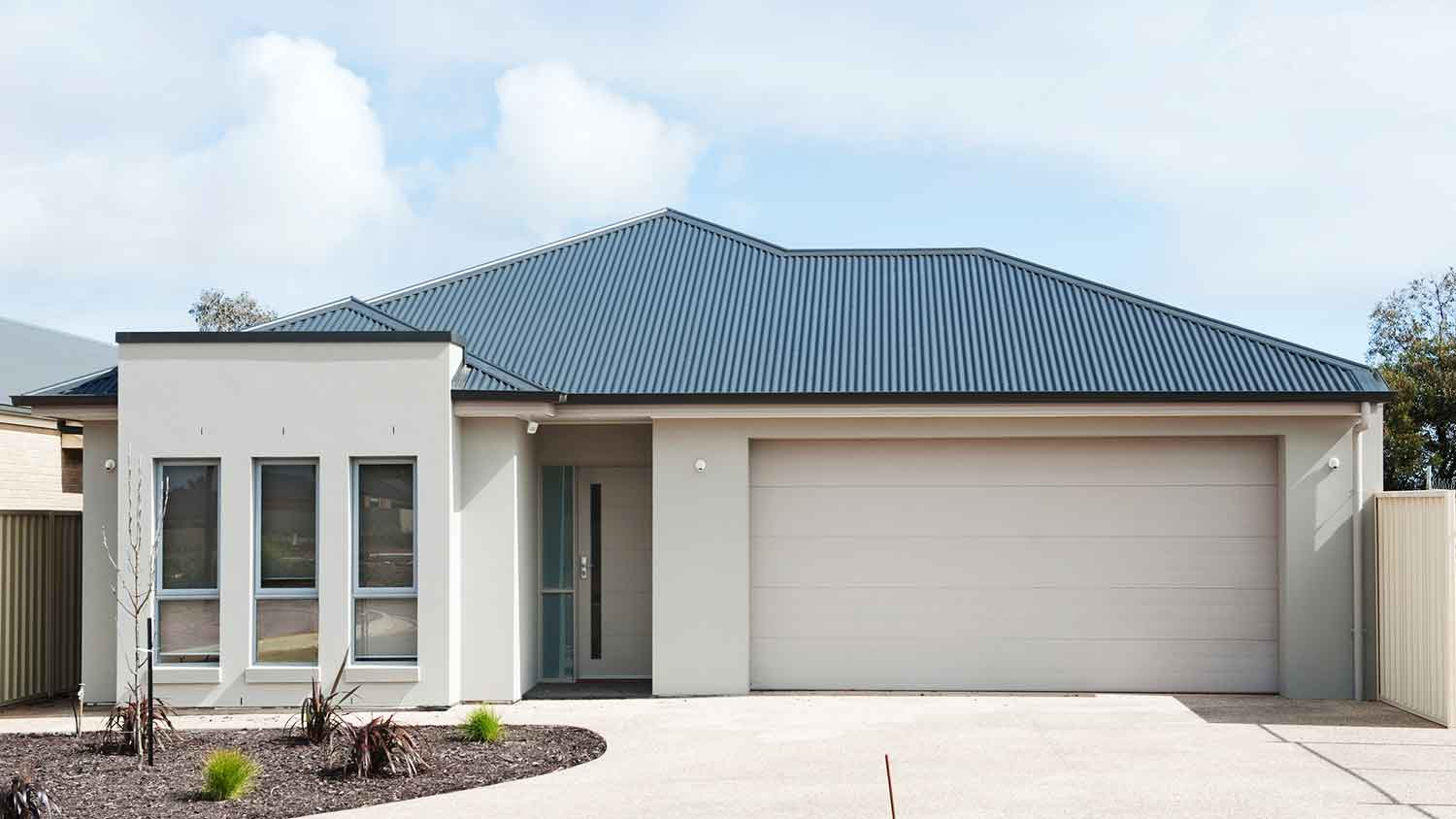 One story suburban house with metal roof 