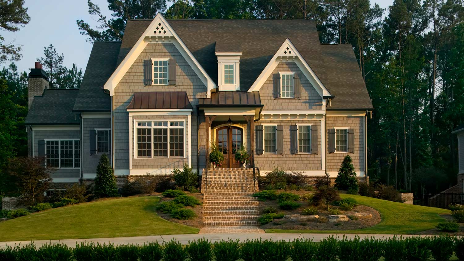 A suburban house with landscaped lawn