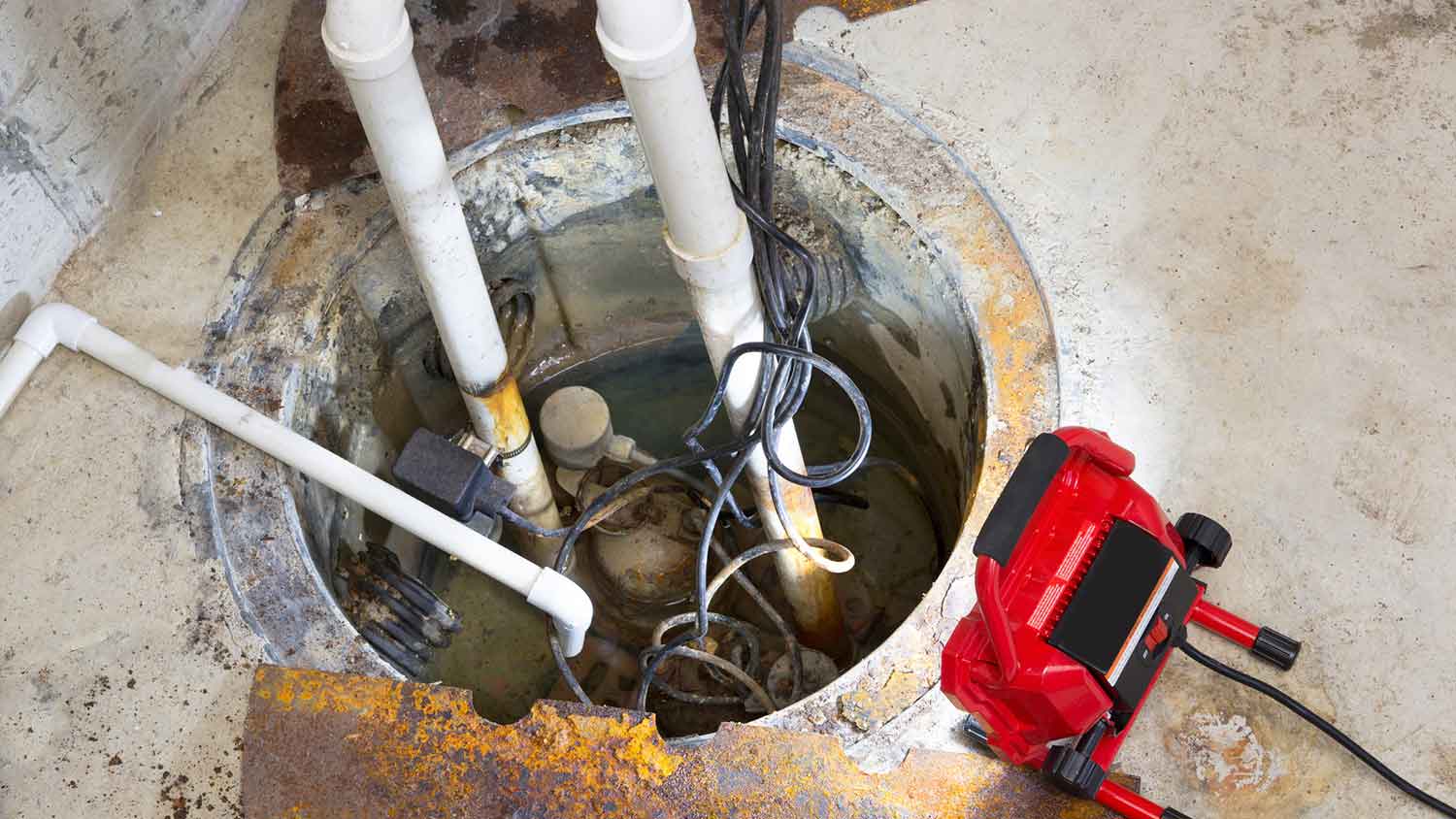 Sump pump installed in a basement is under reparation