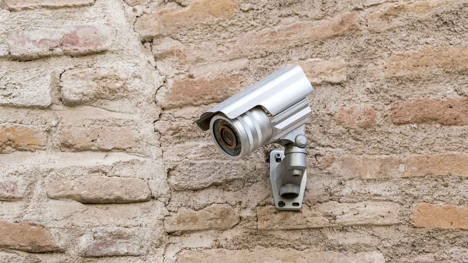 A surveillance camera on the exterior of a house