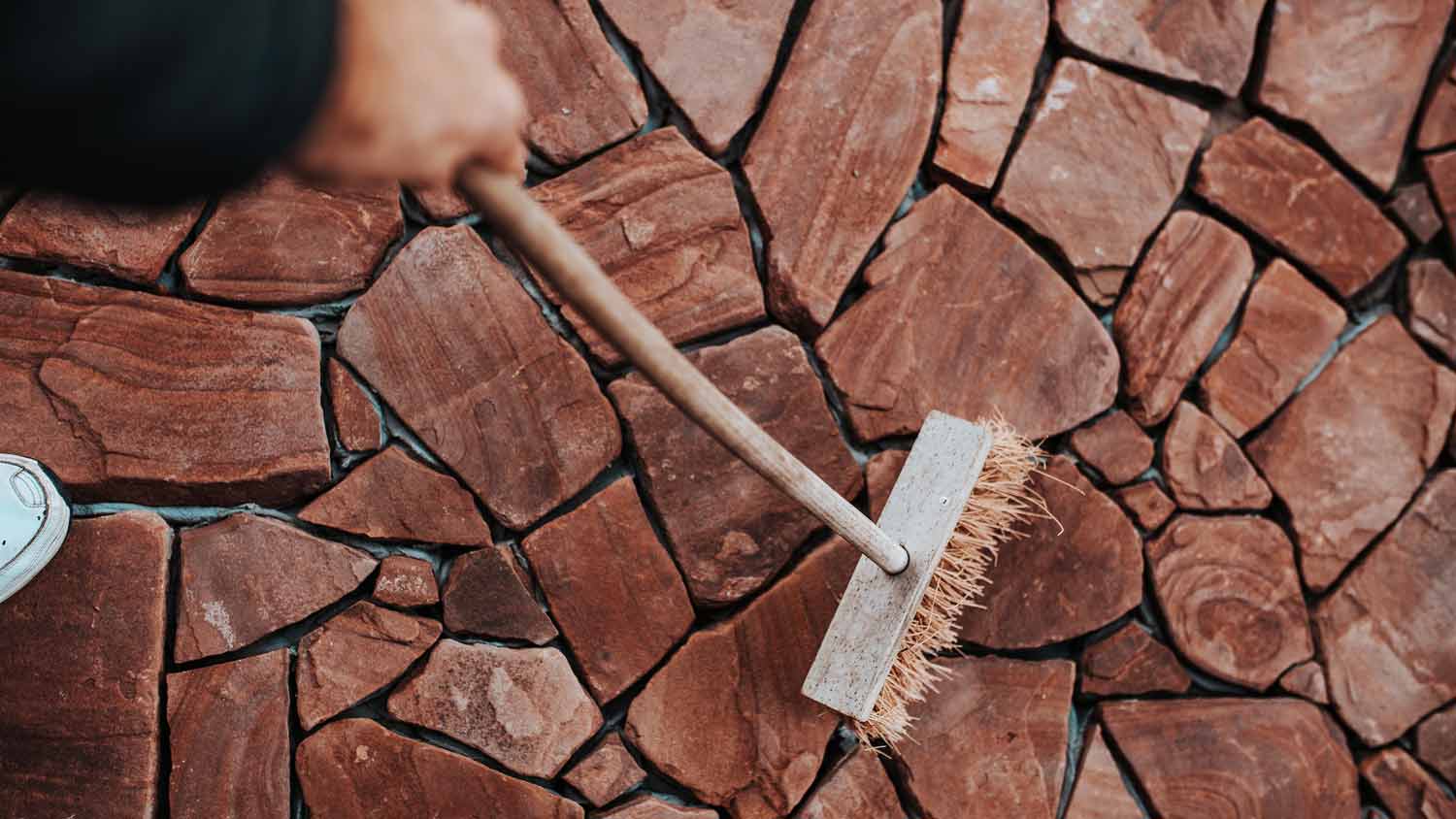 sweeping stamped concrete