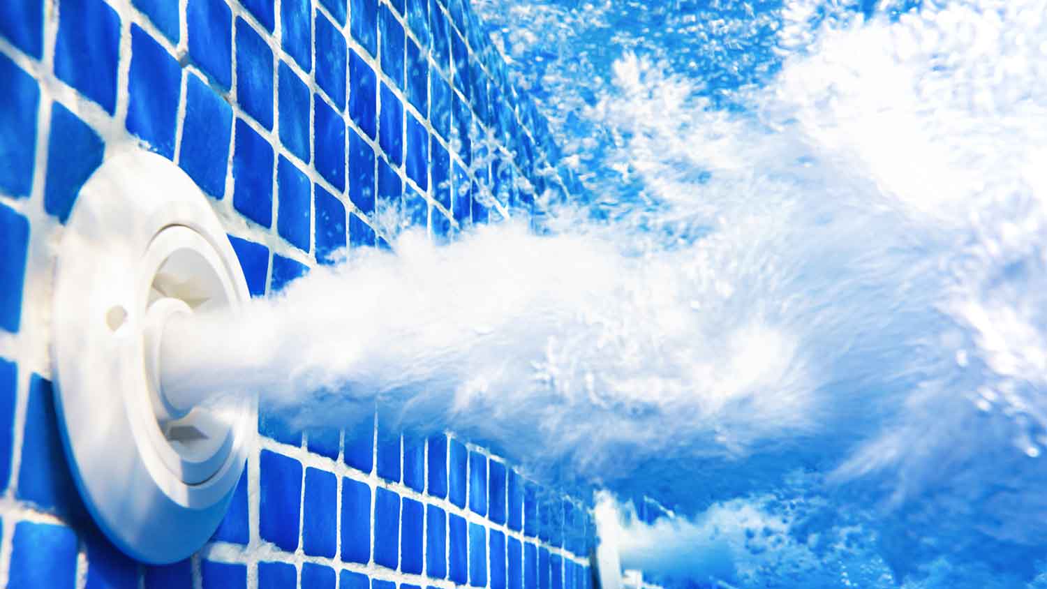 Closeup of swimming pool jets running