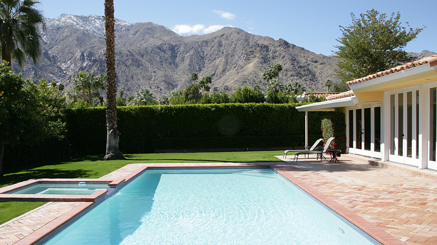 A swimming pool with mountain view