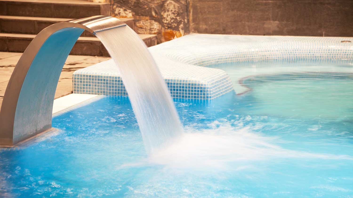 Indoor swimming pool with waterfall