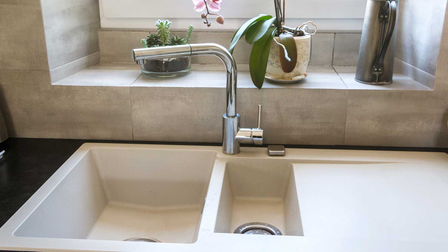 Chrome swivel spout installed on the kitchen sink