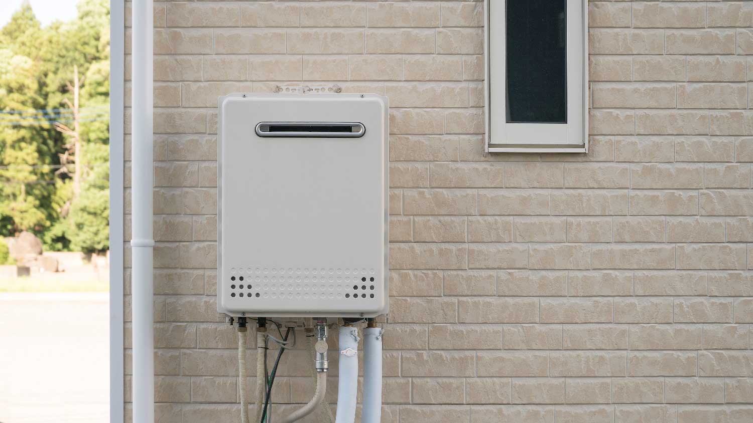 A tankless hot water heater installed in an insulated box