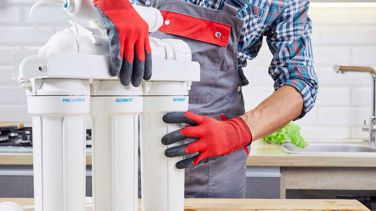 Technician installing reverse osmosis system