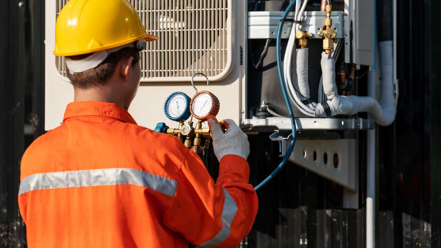 A technician fixing the AC