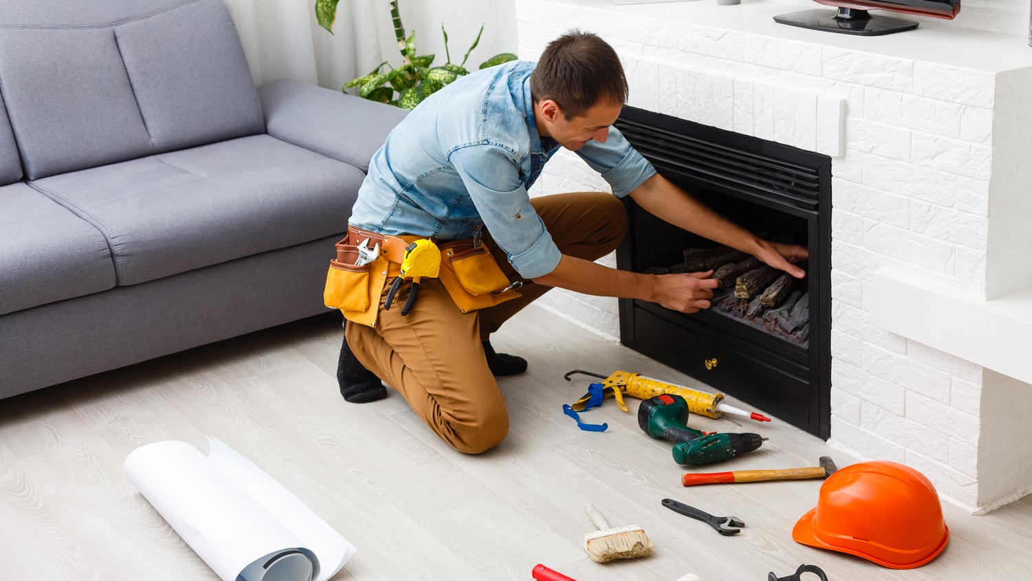 A technician installing a wood fireplace