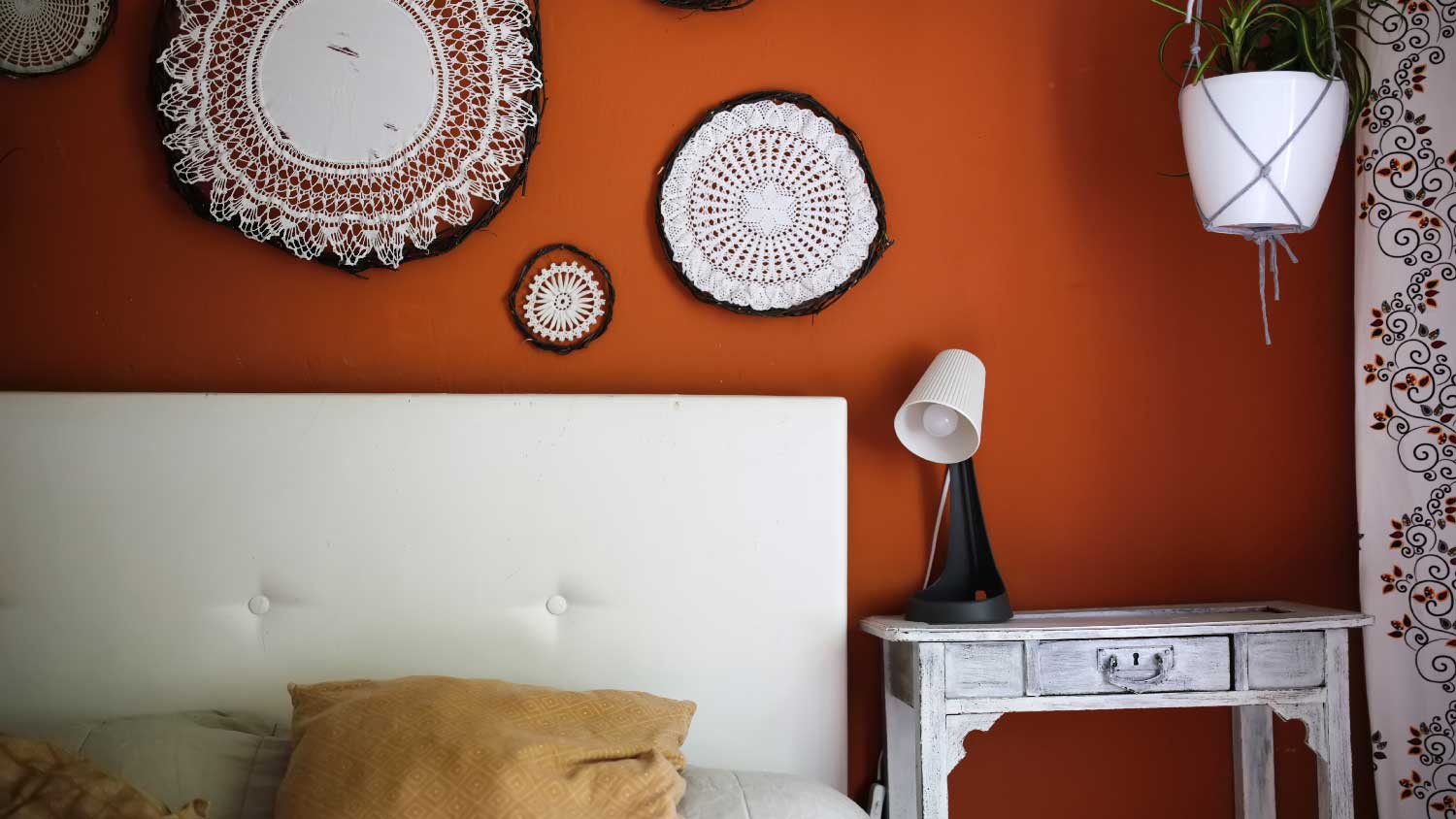 Terracotta walls in a bedroom