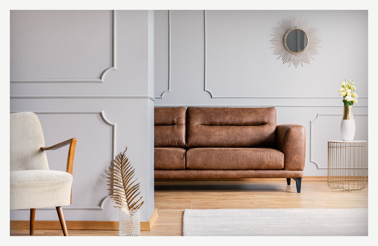 living room with couch and chair with textured wall 