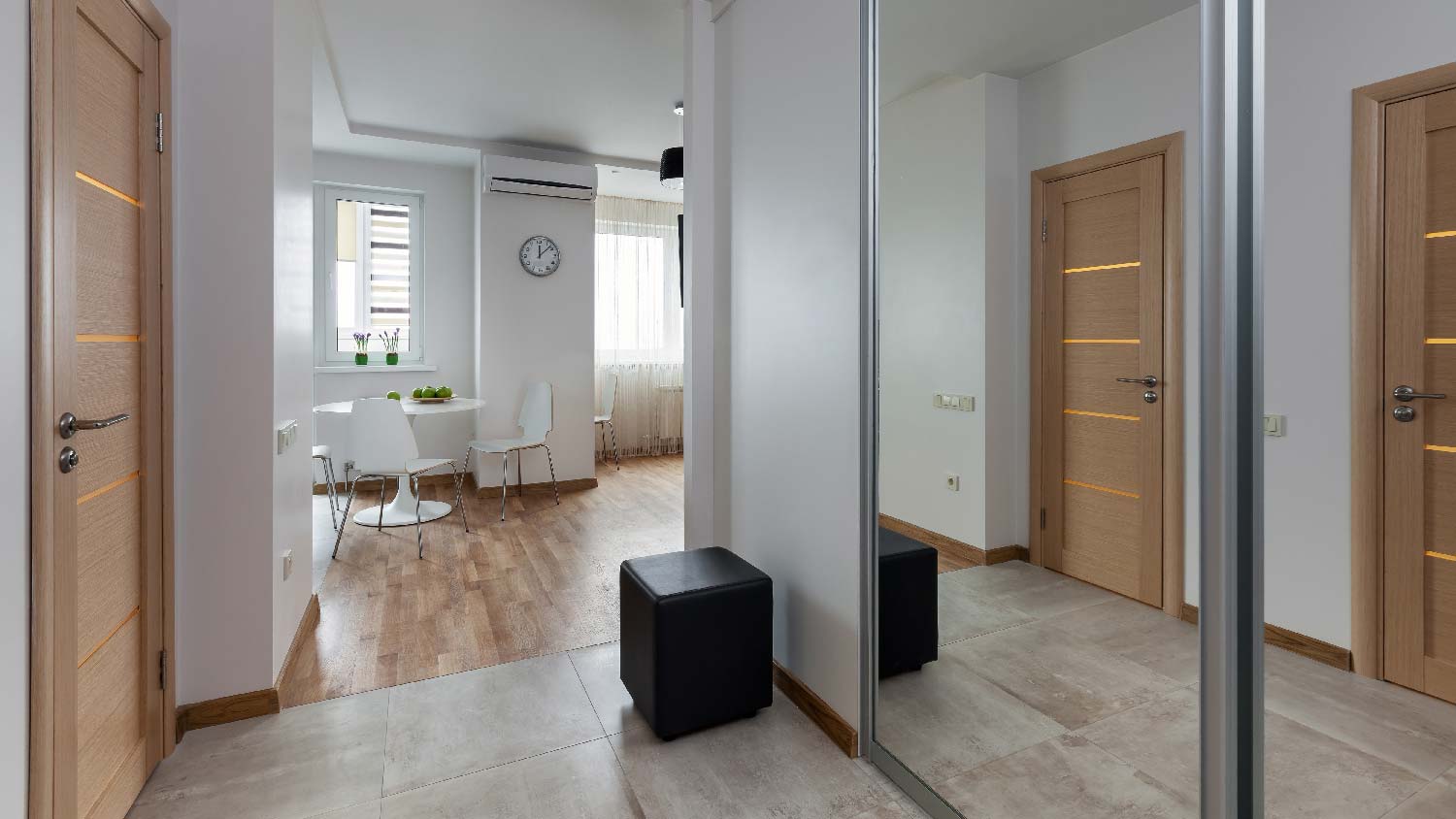 A tile-to-wood floor transition in a home’s dining room