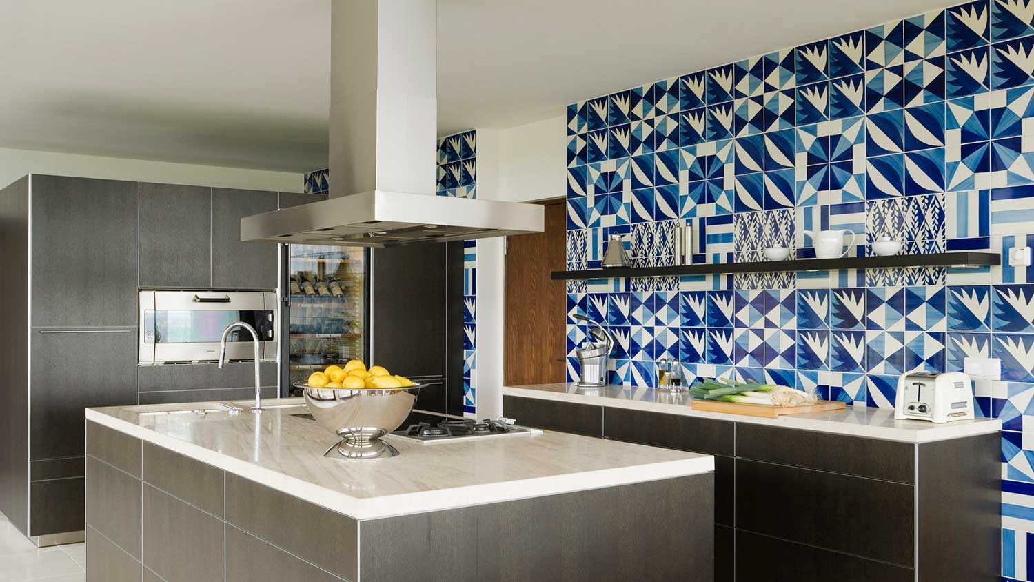 Modern kitchen with blue tile wall