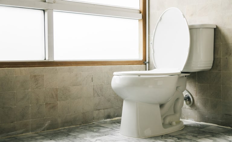 Photo of a toilet in a bathroom