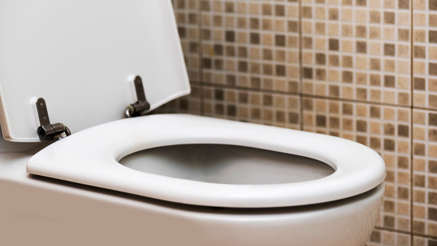 open toilet in yellow bathroom