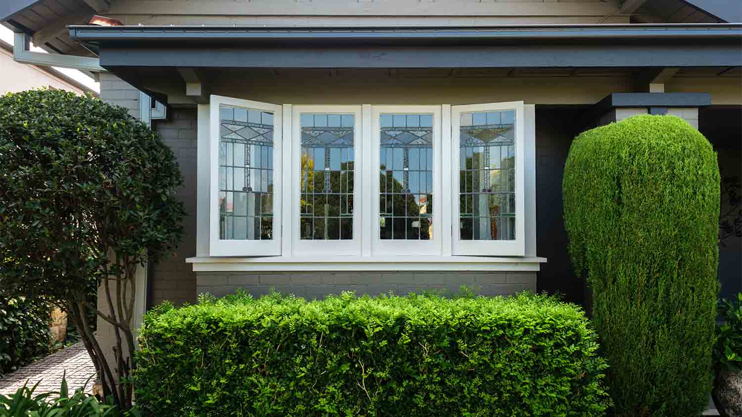 trees and shrubs surrounding home