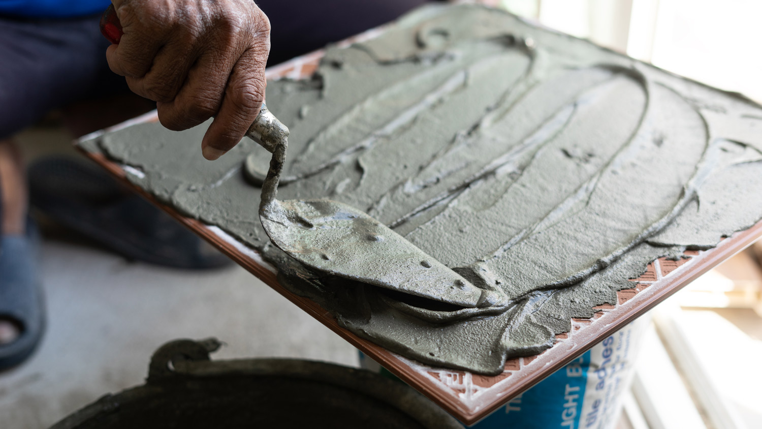 Tile with trowel and plaster