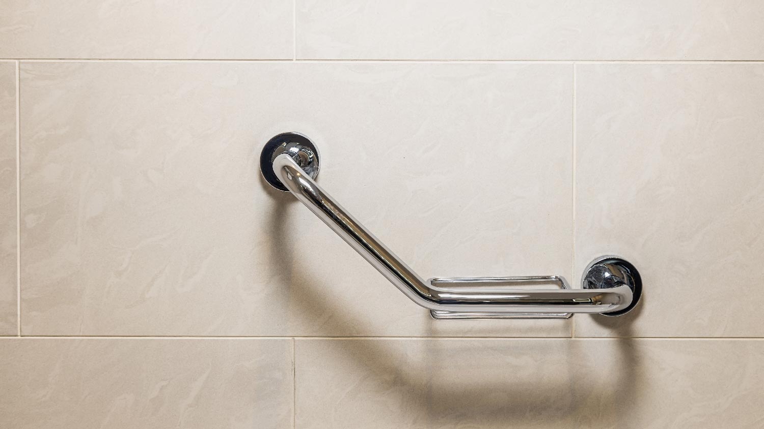 A tub grab bar mounted on the wall