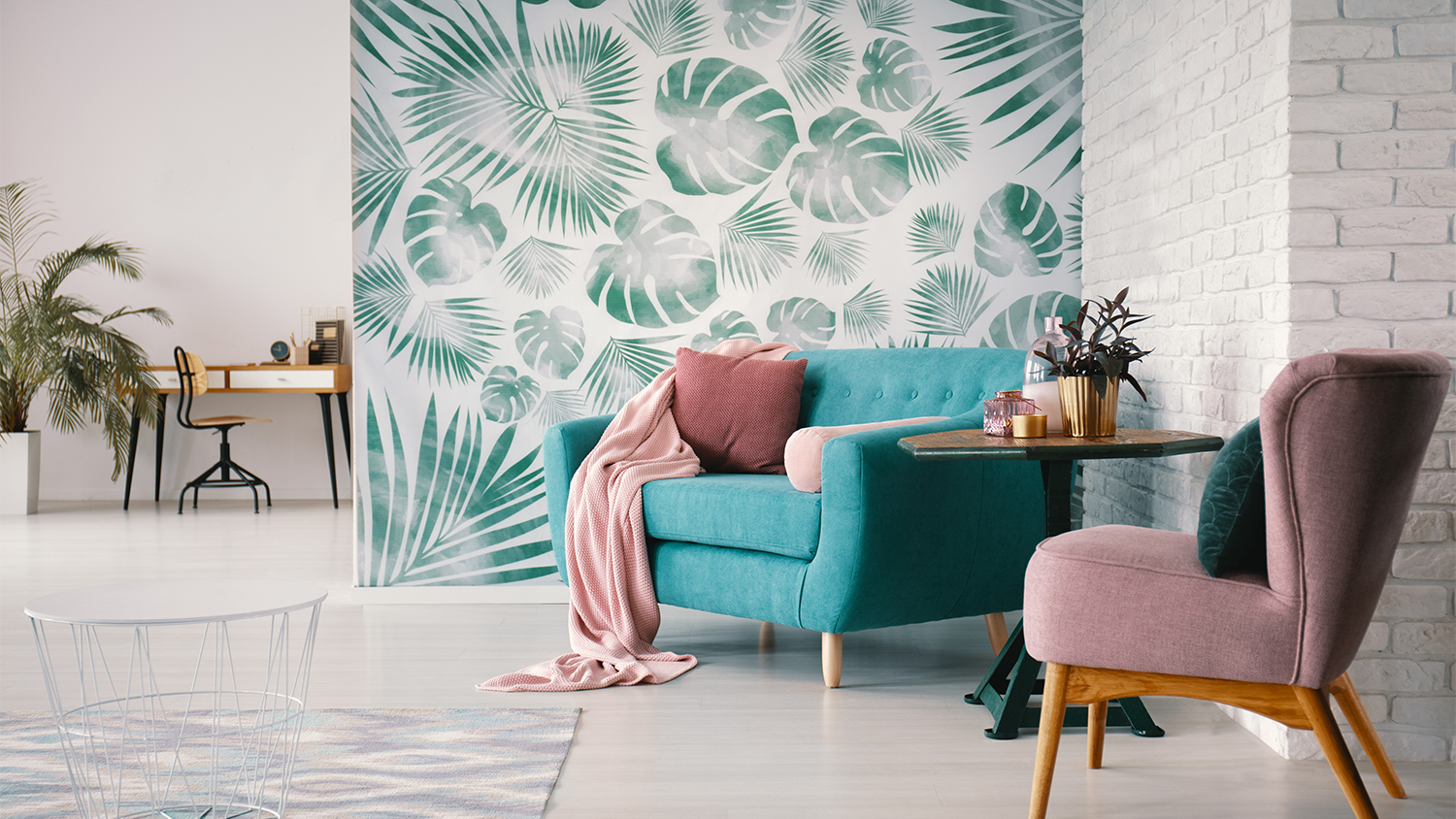 living room with turquoise leaf wallpaper
