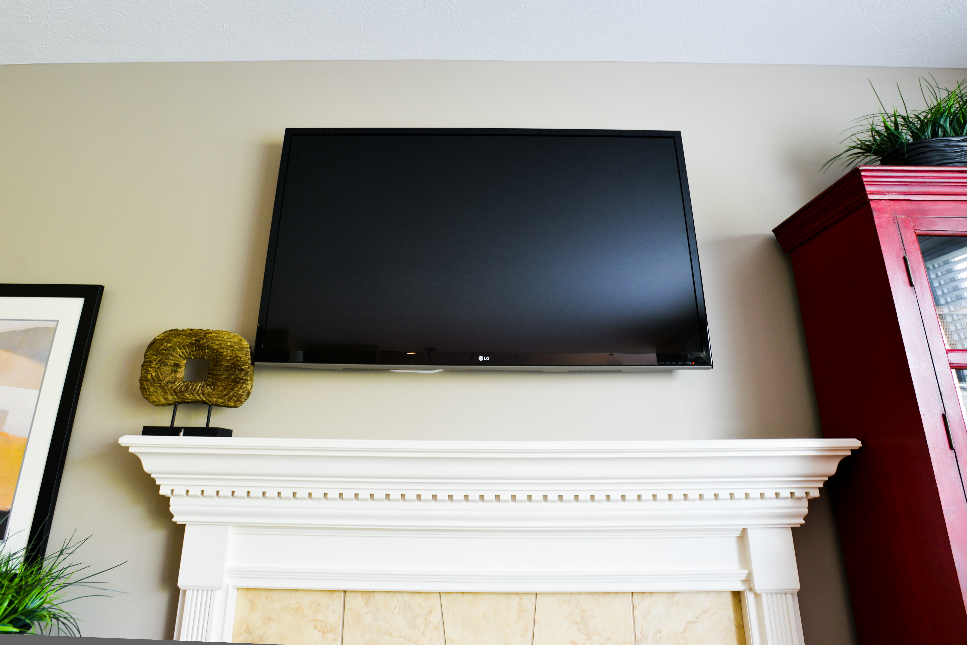 tv mounted over mantel