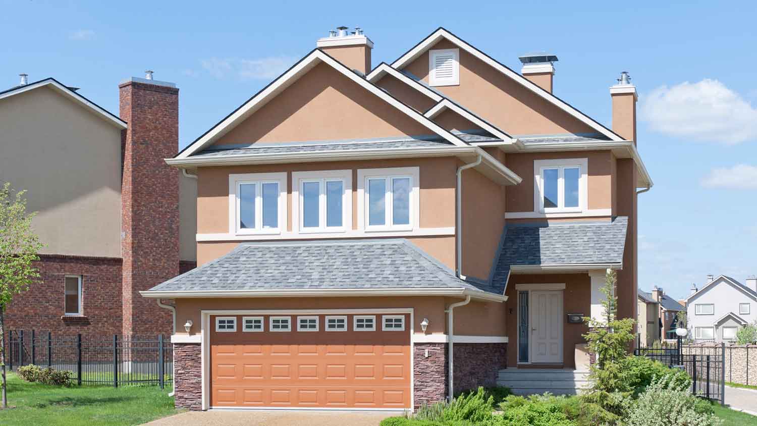 EIFS stucco siding installed on a two-story suburban house