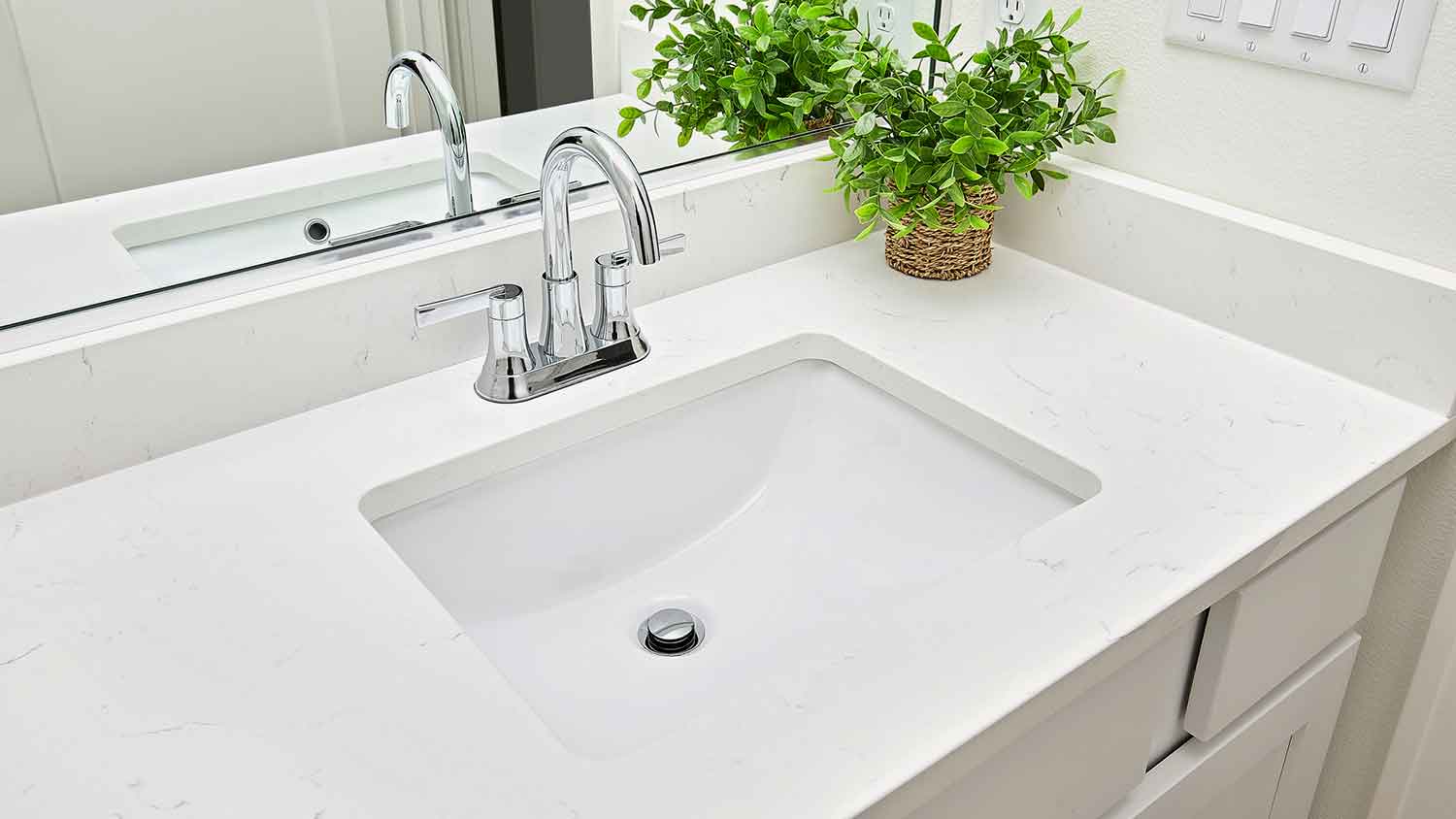 Undermount bathroom sink installed in a modern bathroom