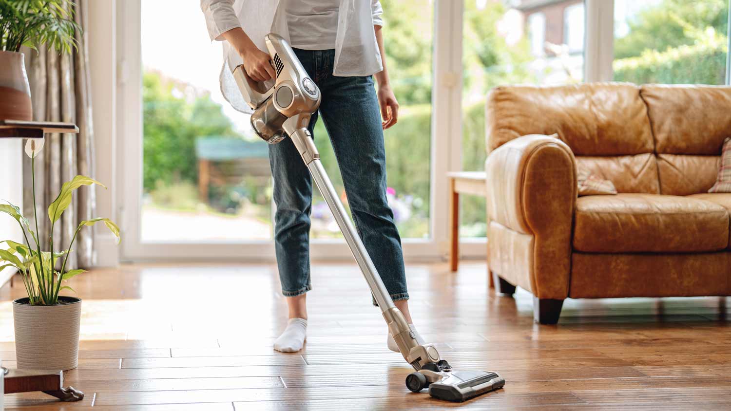 woman vacuuming hardwood floor 