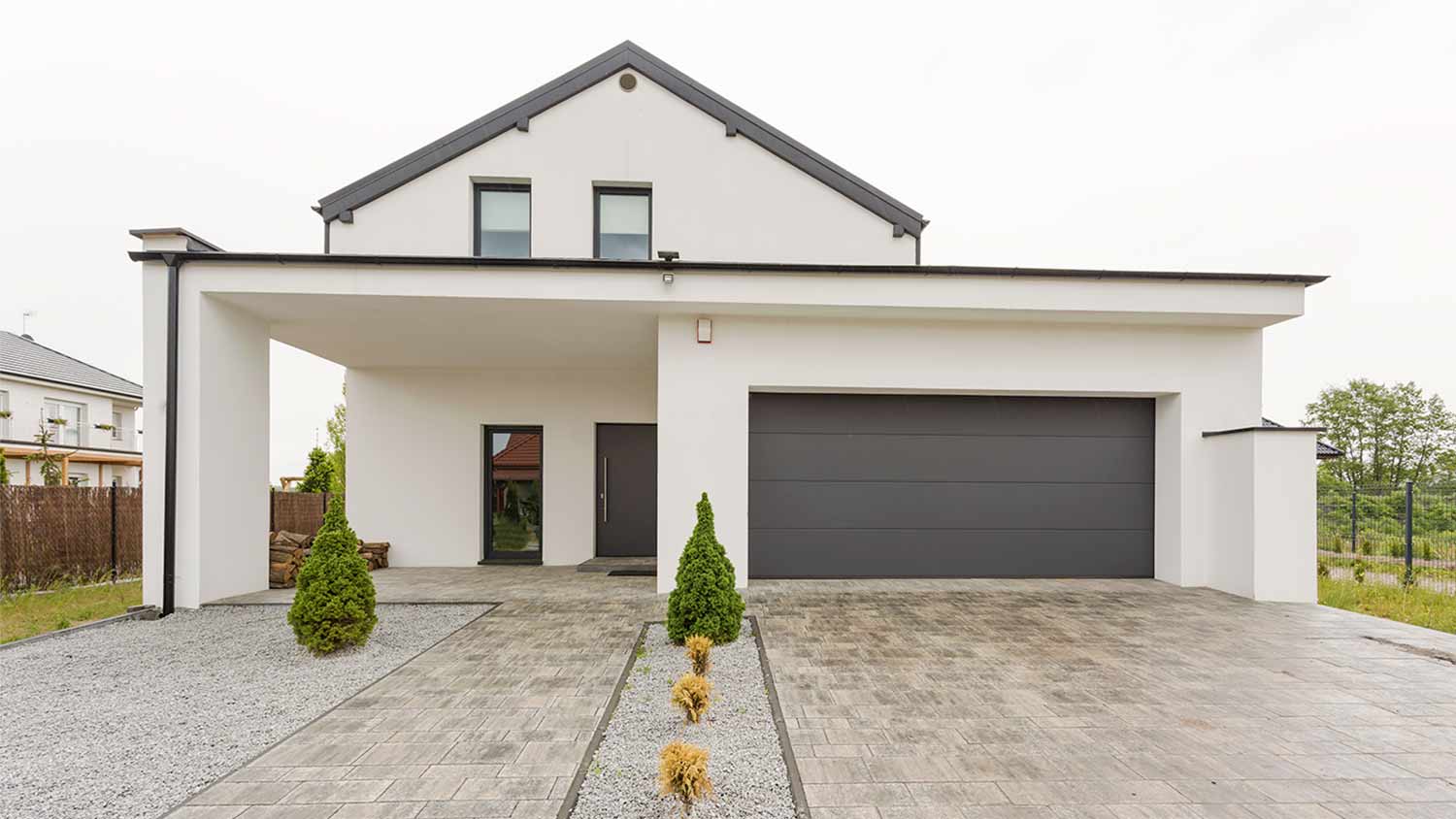 white villa with stone driveway