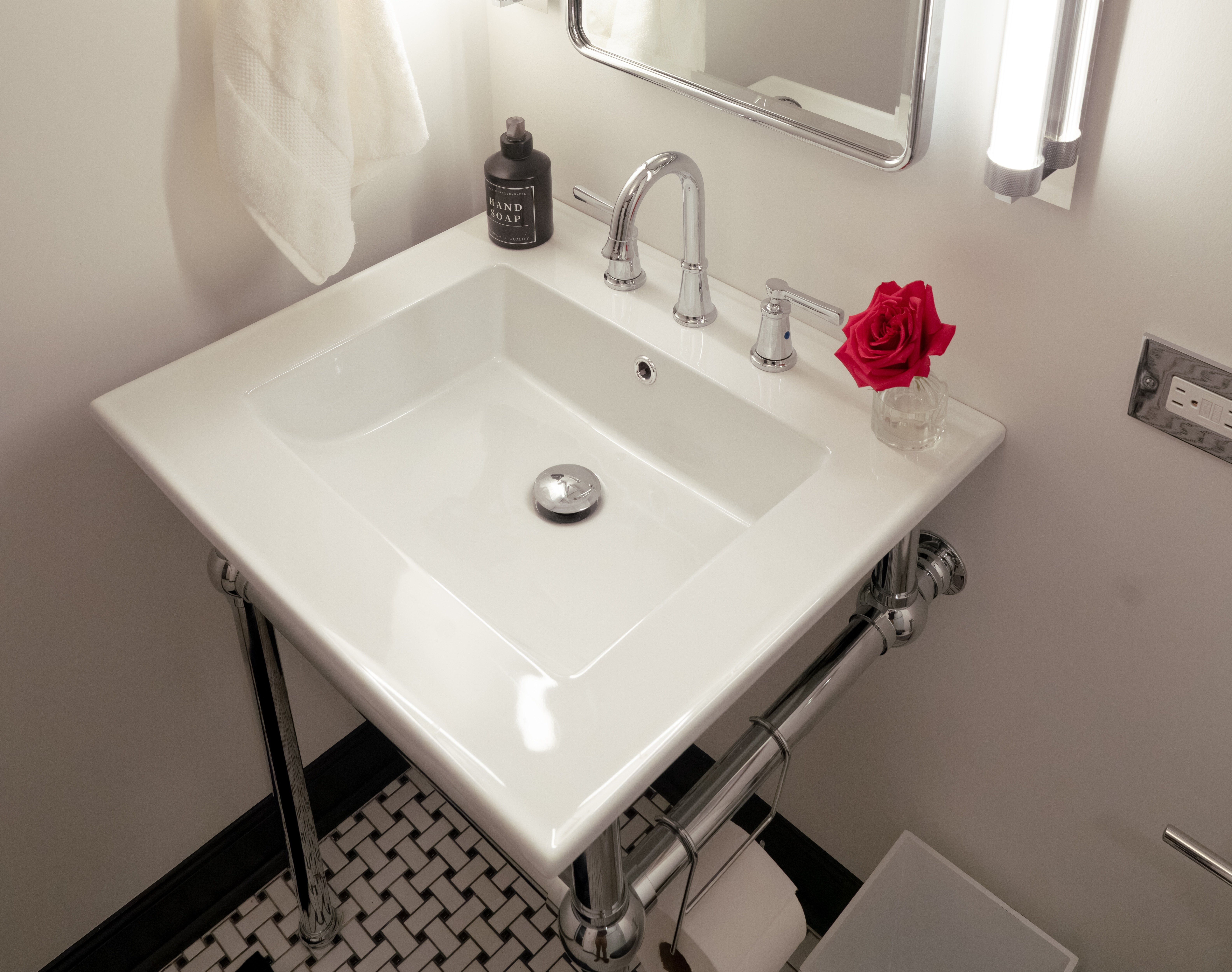 Console sink and medicine cabinet in vintage bathroom remodel