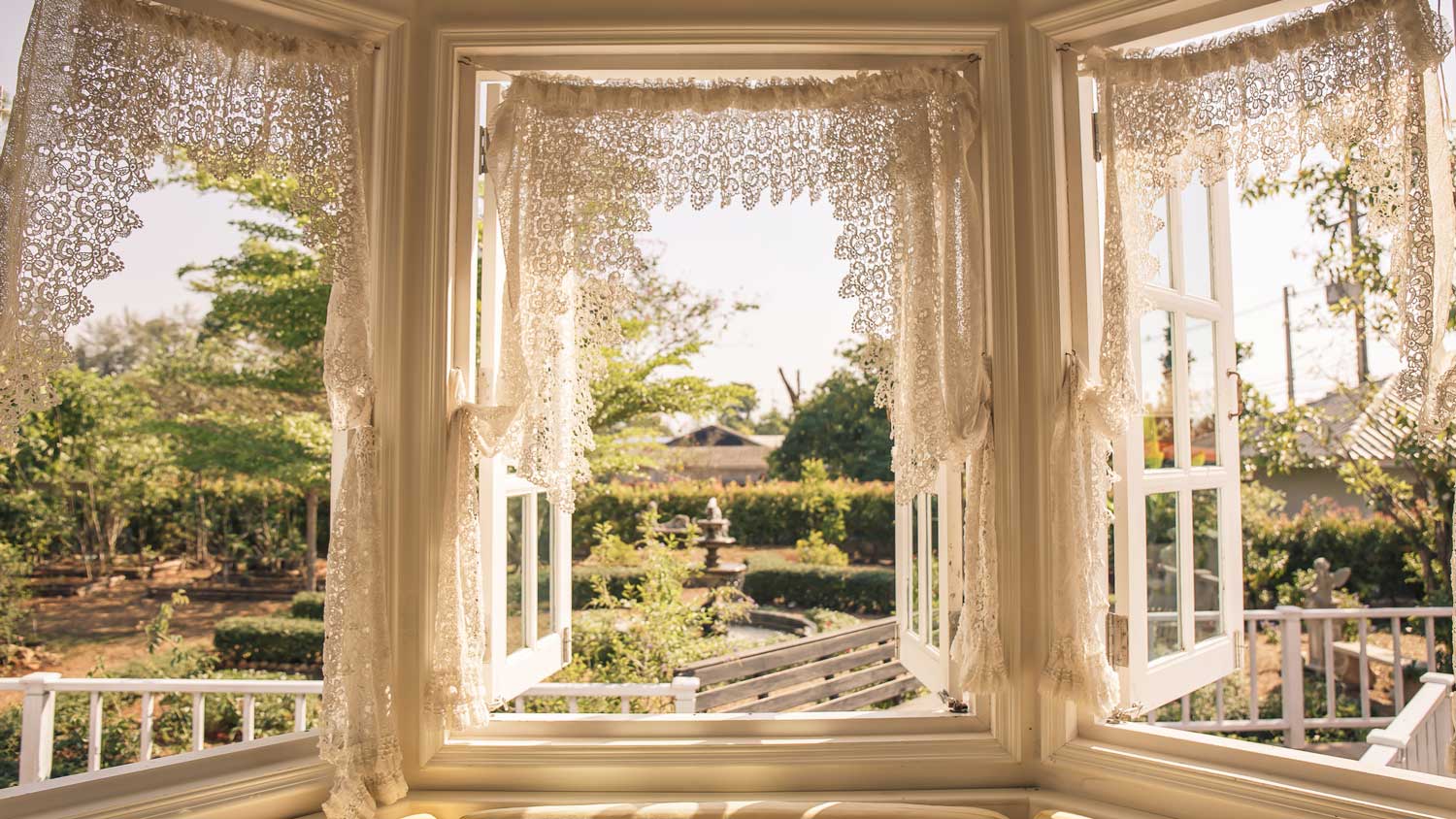 House with vintage windows with a garden view