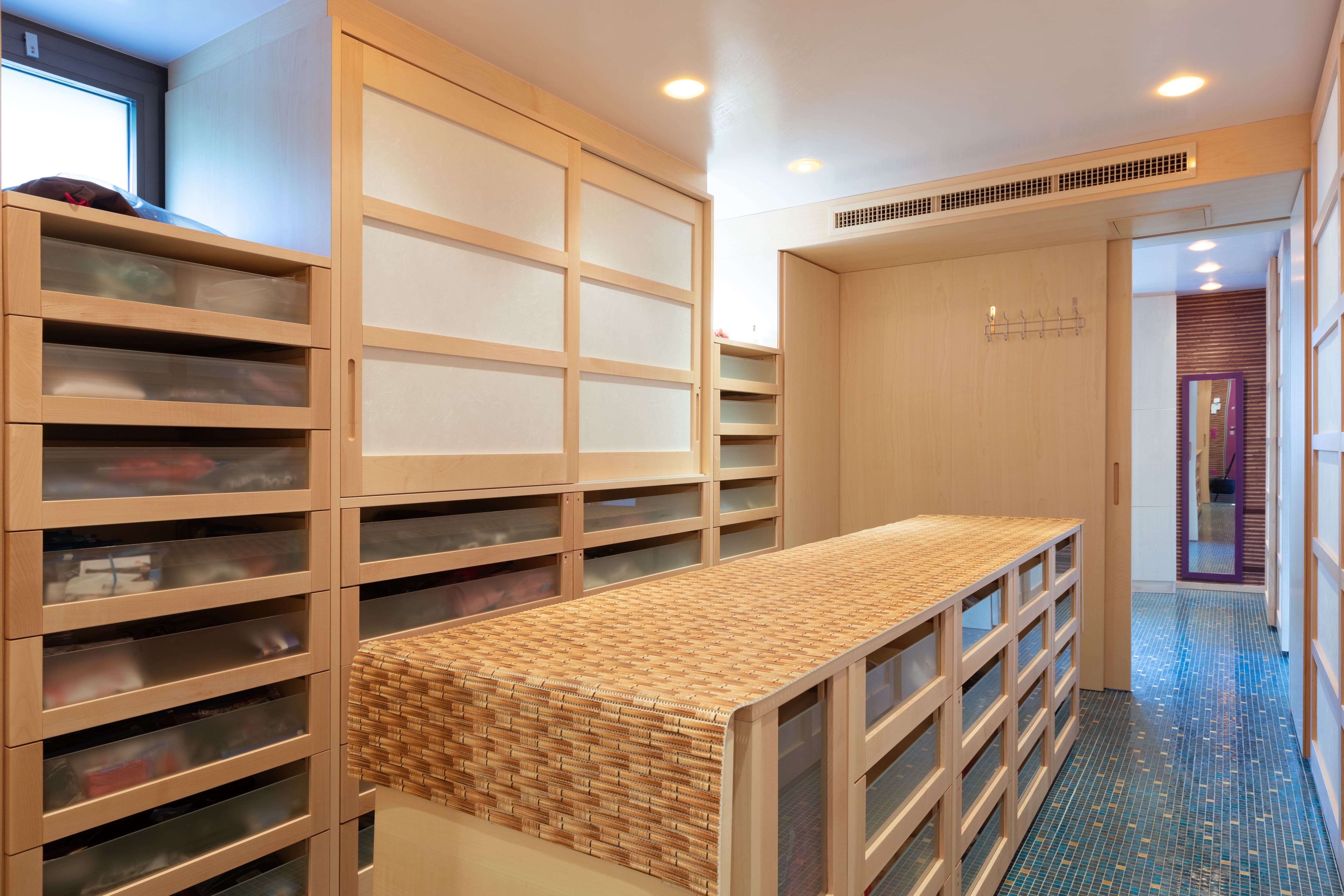 A walk-in closet made solely of drawers